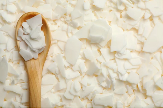 Golden Brands 464 soy wax flakes in a wooden spoon